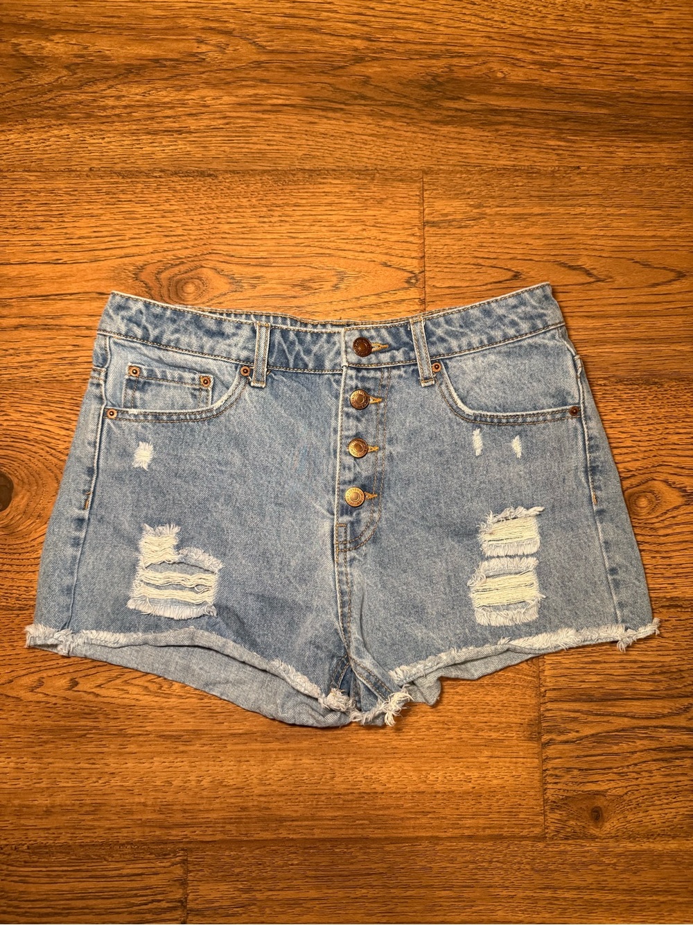 Distressed button down jean shorts with 2 inch inseam
